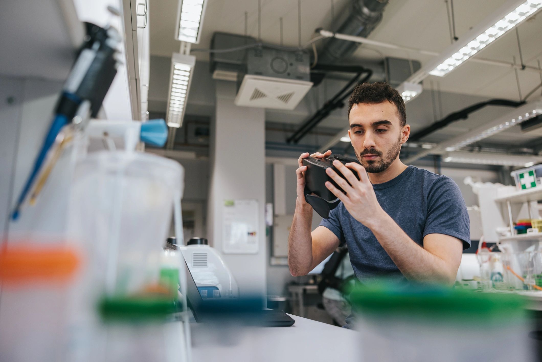 Engineer reviewing a prototype in a laboratory setting